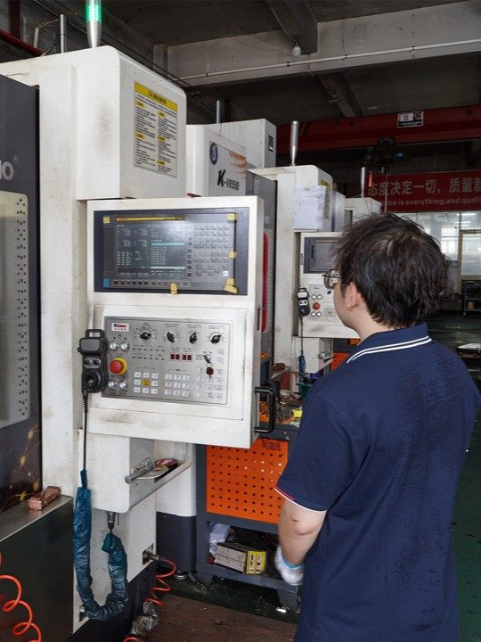 Engineer operating the Sodick equipment